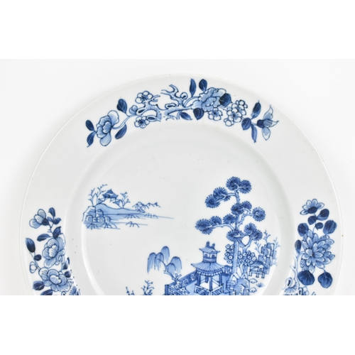 33 - A Chinese 18th century, Qianlong, Nanking Cargo plate, decorated in blue on white depicting a river ... 