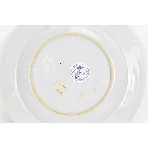 33 - A Chinese 18th century, Qianlong, Nanking Cargo plate, decorated in blue on white depicting a river ... 