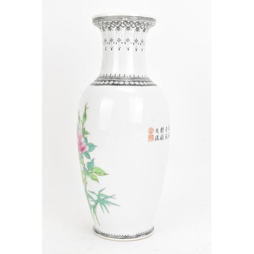 41 - A Chinese Repubic period famille rose vase, painted with a bird perched on blossoming peonies, inscr... 