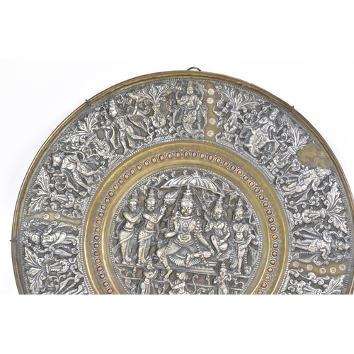 49 - A late 19th century/early 20th century Indian brass, copper and silver overlay plaque, decorated in ... 