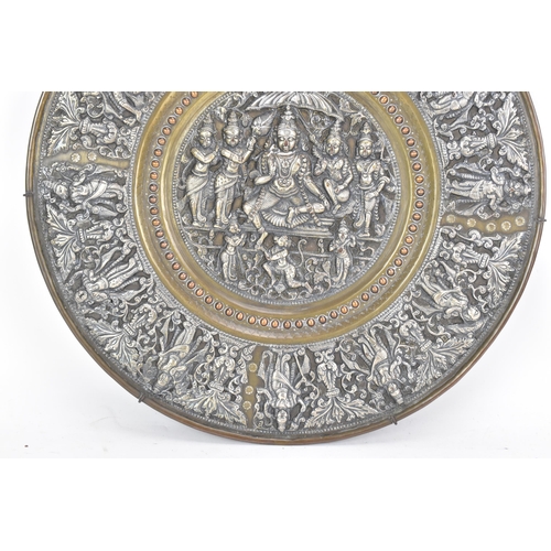 49 - A late 19th century/early 20th century Indian brass, copper and silver overlay plaque, decorated in ... 