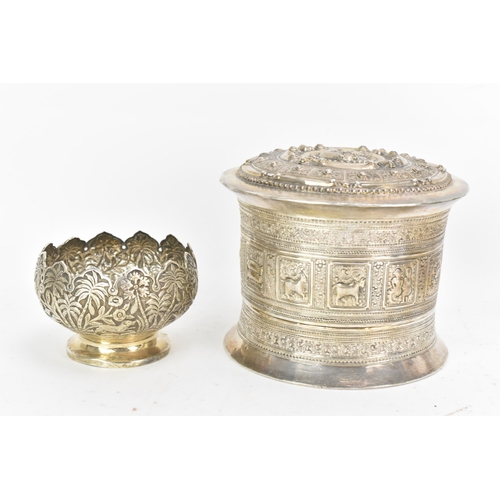 50 - A late 19th/early 20th century Burmese white metal betel box, embossed and incised with panels of fi... 