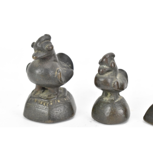 52 - A collection of Burmese opium weights in the form of birds, tallest 6.5cm high, together with an Afr... 