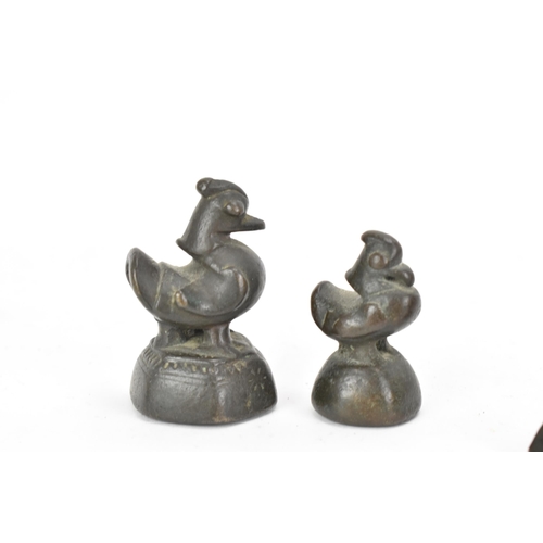 52 - A collection of Burmese opium weights in the form of birds, tallest 6.5cm high, together with an Afr... 