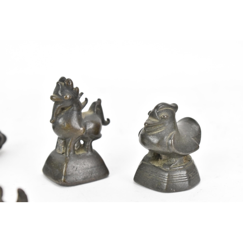 52 - A collection of Burmese opium weights in the form of birds, tallest 6.5cm high, together with an Afr... 