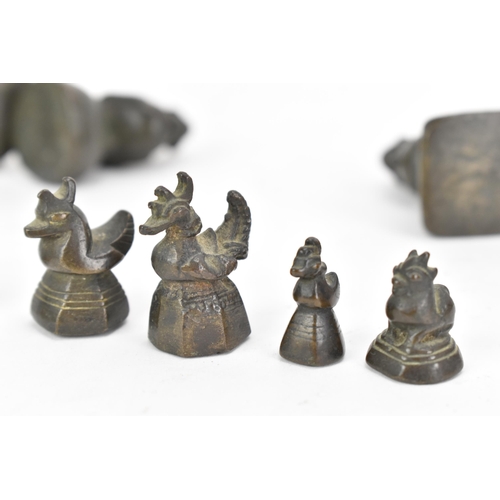 52 - A collection of Burmese opium weights in the form of birds, tallest 6.5cm high, together with an Afr... 