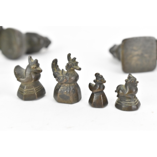 52 - A collection of Burmese opium weights in the form of birds, tallest 6.5cm high, together with an Afr... 