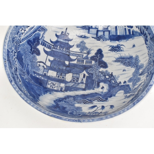 56 - A Chinese export Qing dynasty blue and white punch bowl, late 18th century, the interior painted wit... 