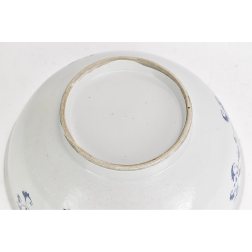 56 - A Chinese export Qing dynasty blue and white punch bowl, late 18th century, the interior painted wit... 