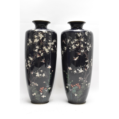 60 - A pair of Japanese Meiji period cloisonne enamel vases, each of tapering form and decorated with a s... 