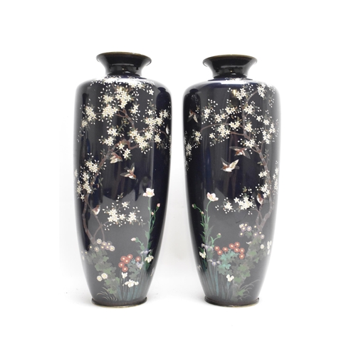 60 - A pair of Japanese Meiji period cloisonne enamel vases, each of tapering form and decorated with a s... 