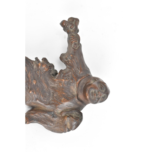 65 - A Chinese Qing dynasty rootwood carving depicting a a figure holding an object to his right hand, 14... 