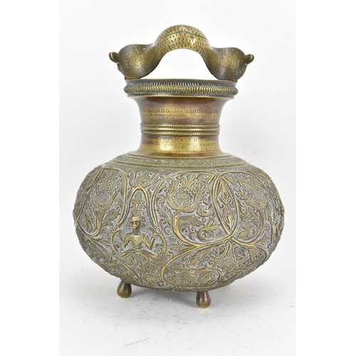 71 - A late 19th/early 20th century Sri Lankan Batavian brass ceremonial vessel, with snake form handle, ... 