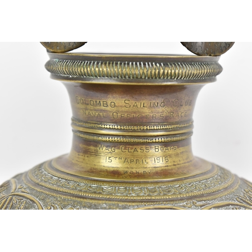 71 - A late 19th/early 20th century Sri Lankan Batavian brass ceremonial vessel, with snake form handle, ... 