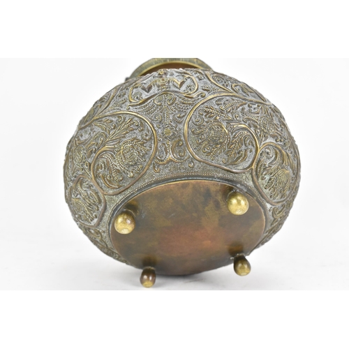 71 - A late 19th/early 20th century Sri Lankan Batavian brass ceremonial vessel, with snake form handle, ... 