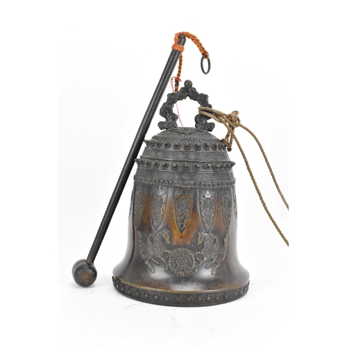 72 - A 19th century Burmese bronze temple bell, decorated with rows of leaf tip studs, Grecian key border... 