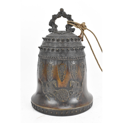 72 - A 19th century Burmese bronze temple bell, decorated with rows of leaf tip studs, Grecian key border... 