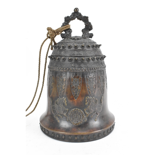 72 - A 19th century Burmese bronze temple bell, decorated with rows of leaf tip studs, Grecian key border... 