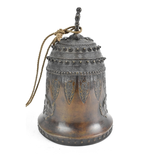 72 - A 19th century Burmese bronze temple bell, decorated with rows of leaf tip studs, Grecian key border... 