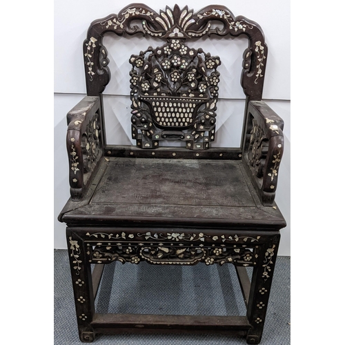 73 - A Chinese Qing dynasty hardwood armchair, having a pierced carved splat in the form of a basket of f... 