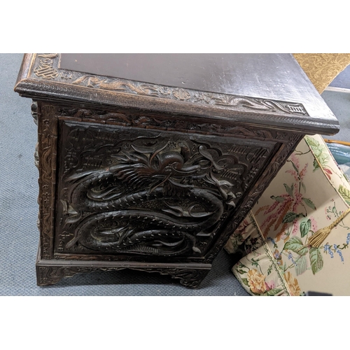 83 - An early 20th century Chinese export padouk wood twin pedestal desk, relief carved decorated with dr... 