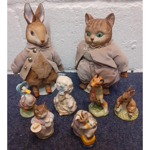 232 - A group of Beatrix Potter collectables to include two Frederick Warne models and 1970's and 80's Roy... 