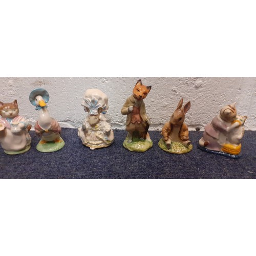 232 - A group of Beatrix Potter collectables to include two Frederick Warne models and 1970's and 80's Roy... 