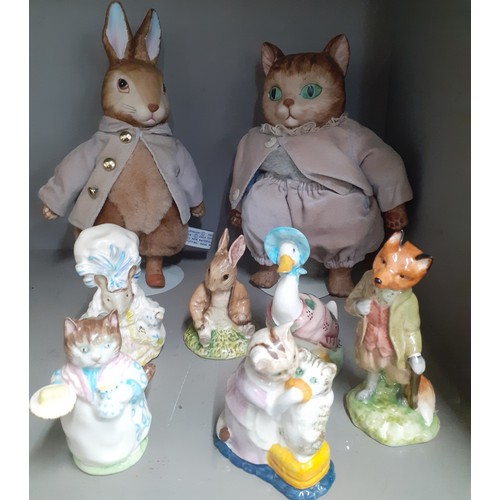 232 - A group of Beatrix Potter collectables to include two Frederick Warne models and 1970's and 80's Roy... 