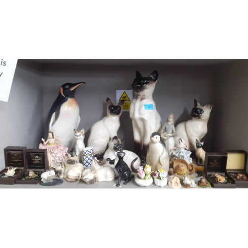 231 - A mixed lot to include Country Artist composition models of animals, Royal Doulton models of cats an... 