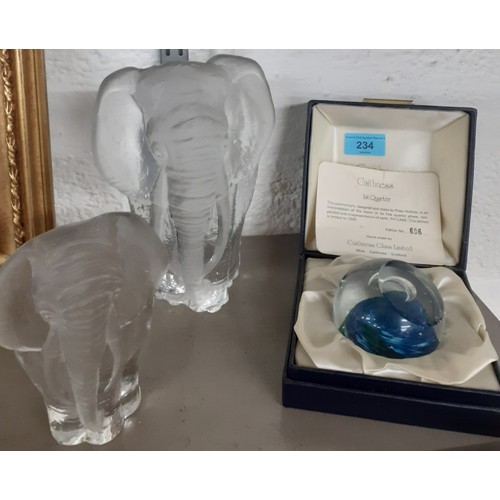 234 - Three glass paperweights to include a Caithness design by Peter Holmes and 2 Mats Jonasson elephant ... 