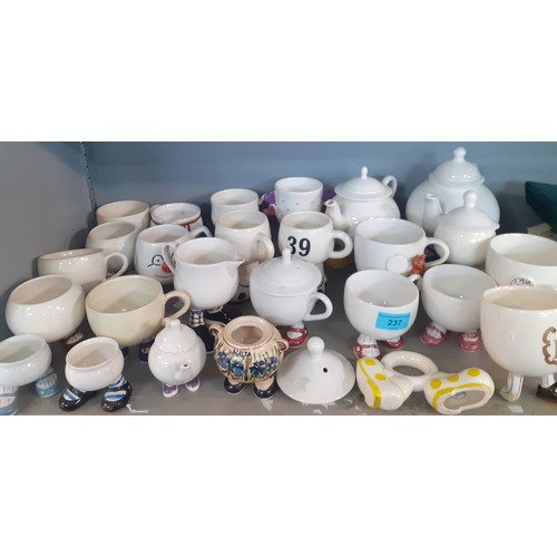 237 - A quantity of mainly vintage novelty mugs and tea ware on legs to include Carlton Ware and Bristow.
... 