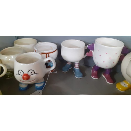 237 - A quantity of mainly vintage novelty mugs and tea ware on legs to include Carlton Ware and Bristow.
... 