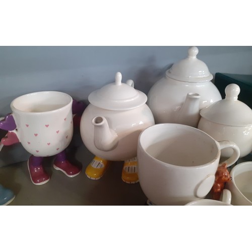 237 - A quantity of mainly vintage novelty mugs and tea ware on legs to include Carlton Ware and Bristow.
... 