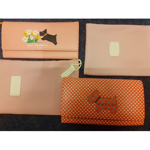 27 - Radley- Two unused leather purses in different designs with branded dust-bags. Location:R2.3
Conditi... 