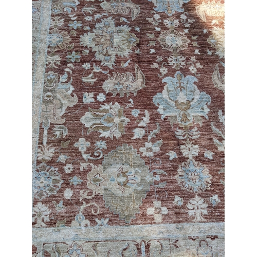 159 - An Afghanistan carpet with pelmets and flowers on a brown ground 300 x 230cm 
Location:G
If there is... 