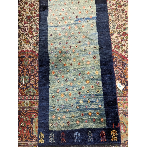 161 - An Iranian Gabbeh runner with repeated motif on a mottled blue ground 330cm x 62cm
Location:A4B FLOO... 