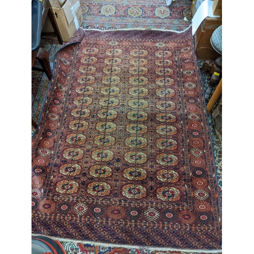 171 - A Turkoman rug with four rows of gulls 191cm x 136cm

Location:G
If there is no condition report sho... 