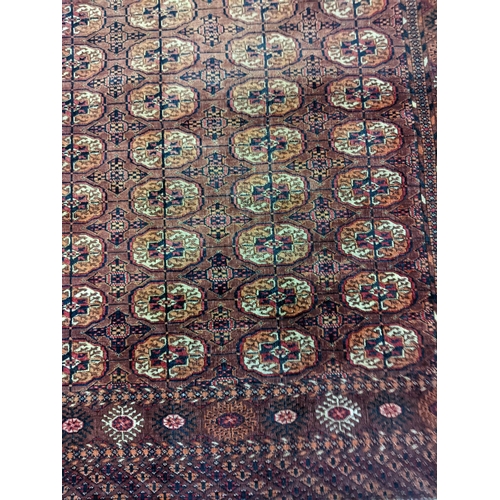 171 - A Turkoman rug with four rows of gulls 191cm x 136cm

Location:G
If there is no condition report sho... 