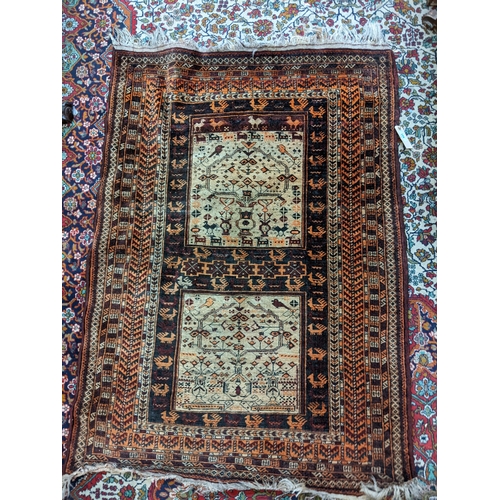 175 - An Afghanistan Belouch rug with two panels of geometric motifs 130x 95cm
Location:G
If there is no c... 