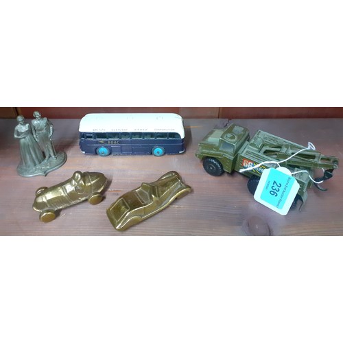 236 - A vintage Dinky BOAC bus, a Matchbox Battle Kings 66 Repair tow army vehicle and other items
Locatio... 