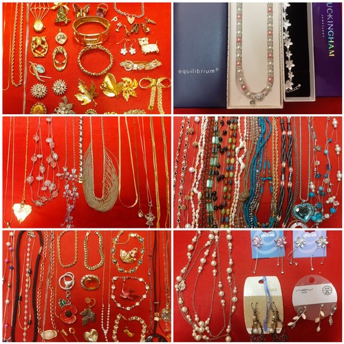 114 - A large quantity of modern fashion jewellery to include gold tone chains, a Trifari gold tone heart ... 