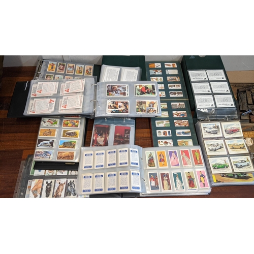 109 - A large collection of cigarette and collectors cards, mostly in albums, to include Vauxhall's 90th A... 