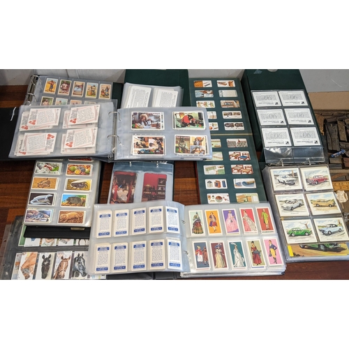 109 - A large collection of cigarette and collectors cards, mostly in albums, to include Vauxhall's 90th A... 