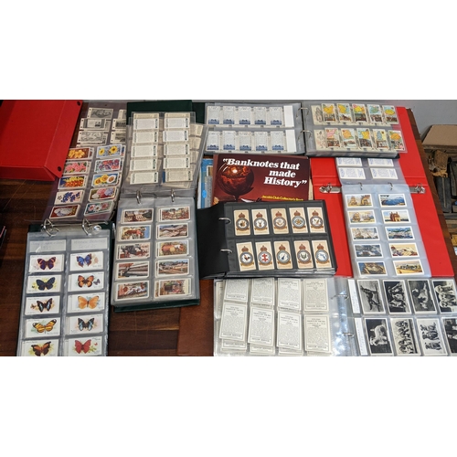 112 - A collection of cigarette cards, mostly in albums, to include Hidden Beauties, Ports of the World, C... 