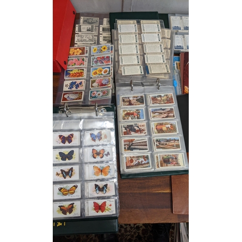 112 - A collection of cigarette cards, mostly in albums, to include Hidden Beauties, Ports of the World, C... 