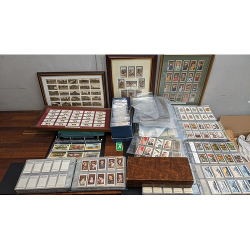 115 - A collection of cigarette cards in frames and albums to include Will's Cinema Stars, Flowering Trees... 