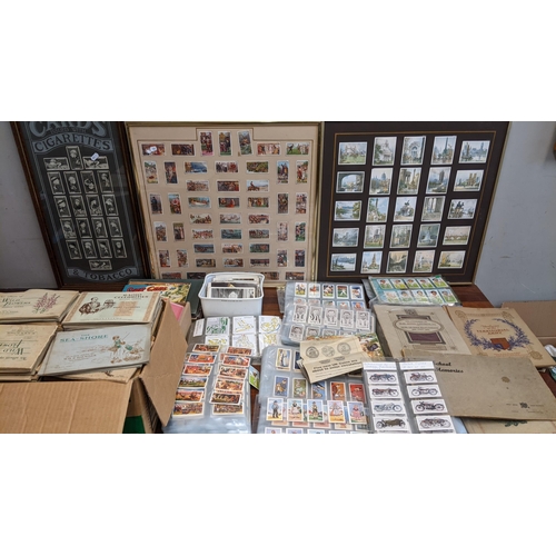 116 - A collection of cigarette and collectors cards in albums and frames to include Radio Celebrities, St... 