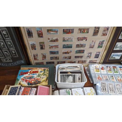 116 - A collection of cigarette and collectors cards in albums and frames to include Radio Celebrities, St... 