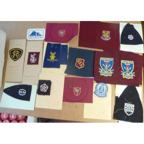 124 - Mainly New Old stock Cloth Golf Badges with manufactures order forms and sample examples for assorte... 