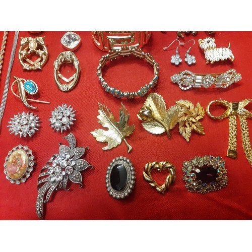 114 - A large quantity of modern fashion jewellery to include gold tone chains, a Trifari gold tone heart ... 